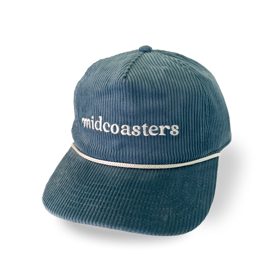 Blue corduroy cap with white embroidered 'midcoasters' text 